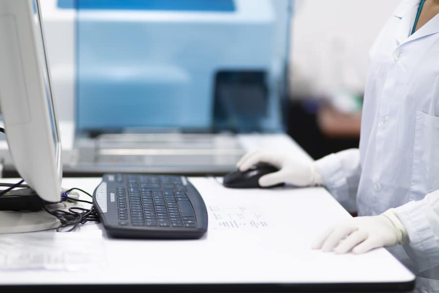 Female Nurse Working On Laptop Computer