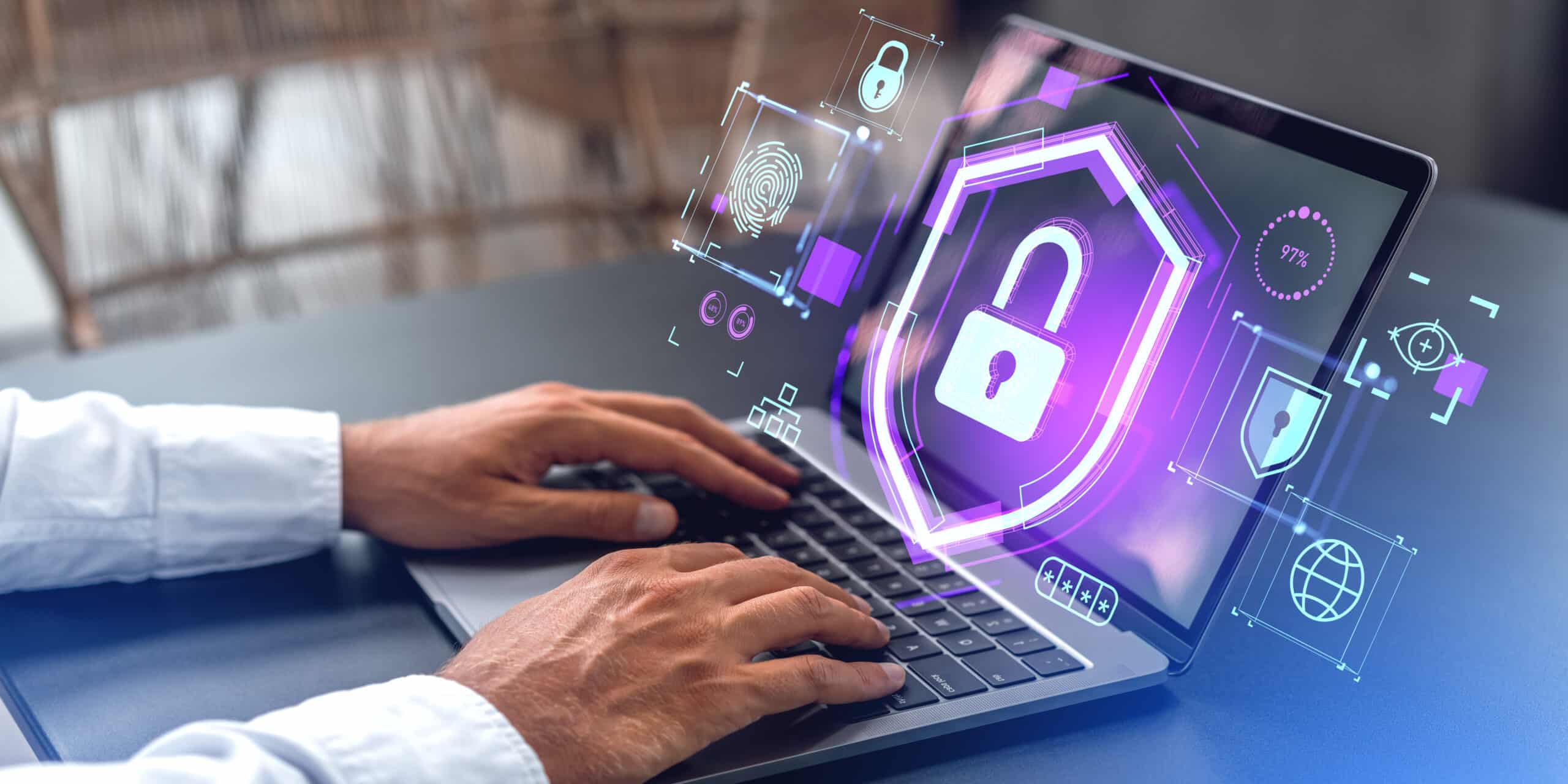 Man hands using laptop with data protection interface in office