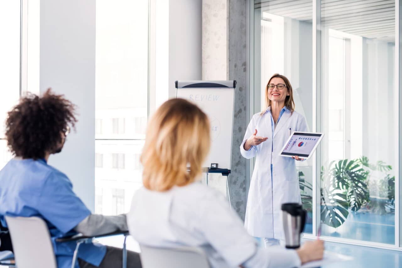 Group of doctors talking about corona virus on conference.